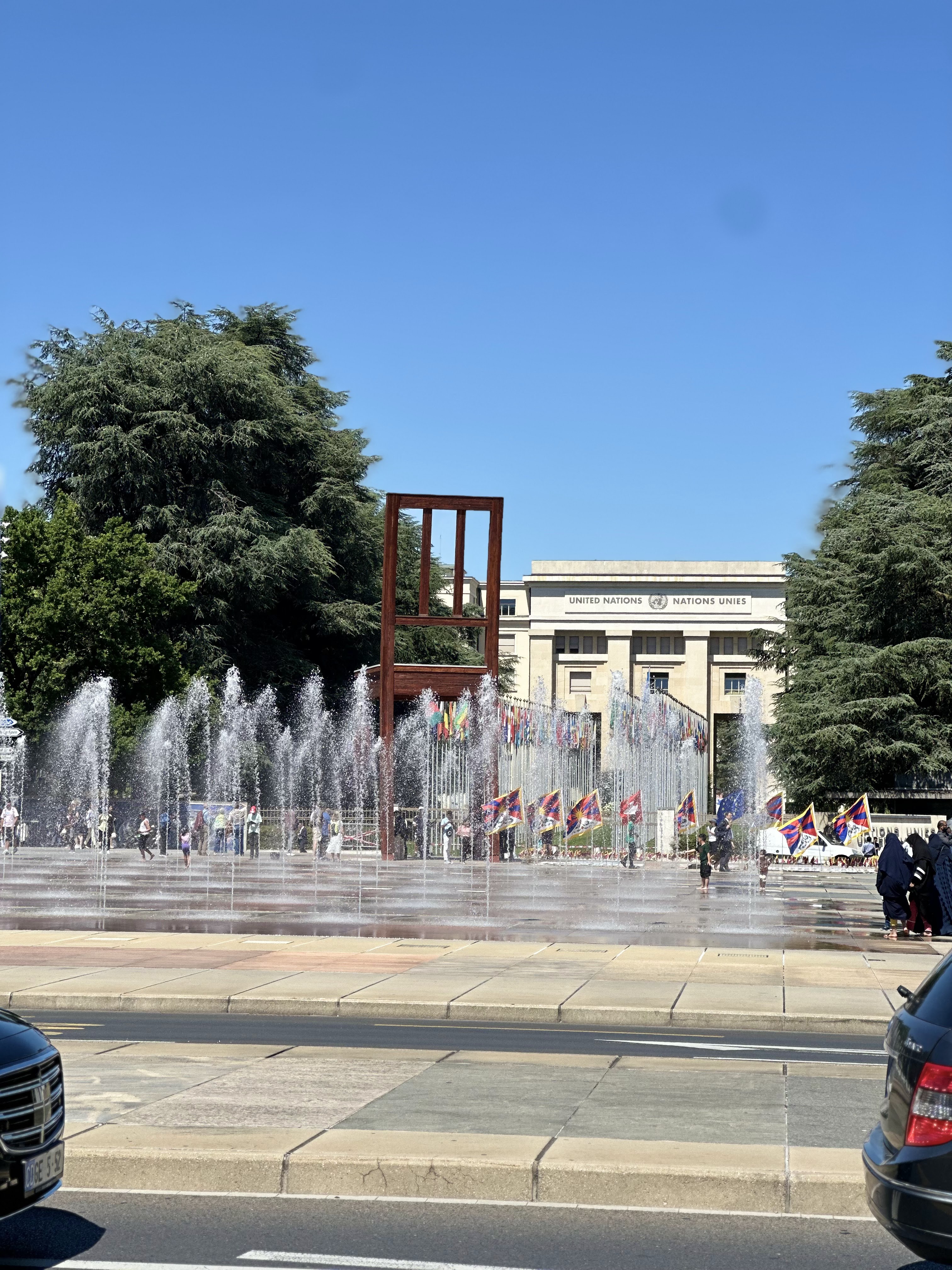 Looking up at the monumental broken chair sculpture from the square